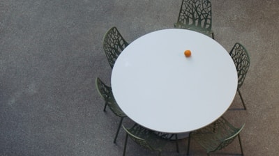 an overhead view of a table and chairs