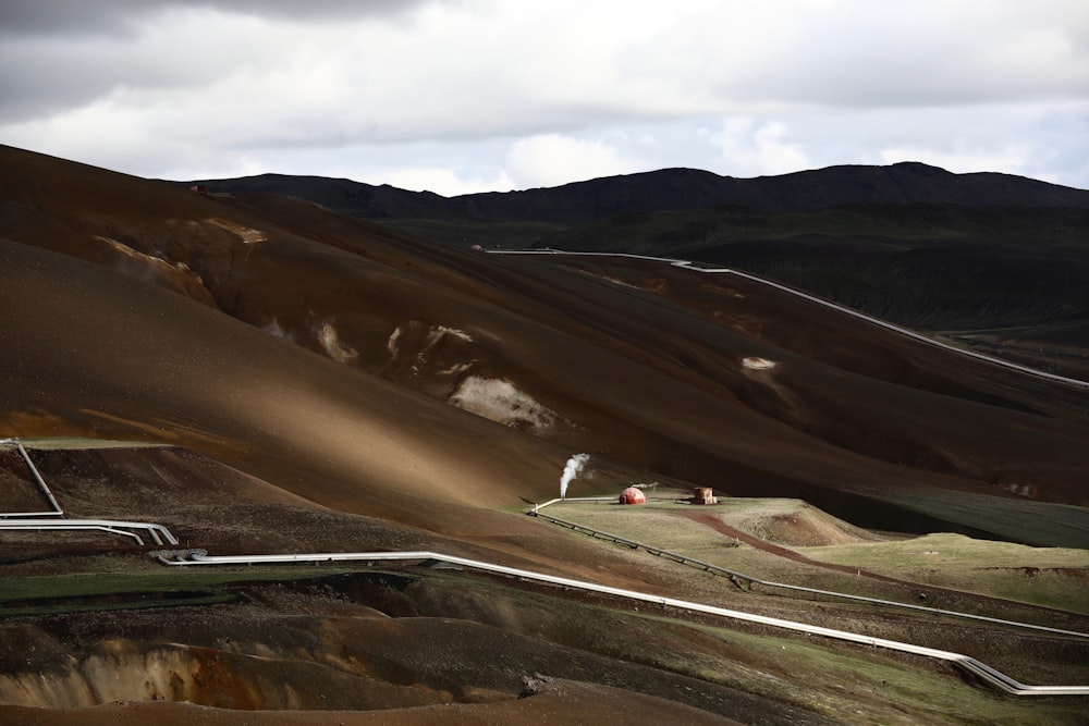 a landscape of hills and hills with a sky background