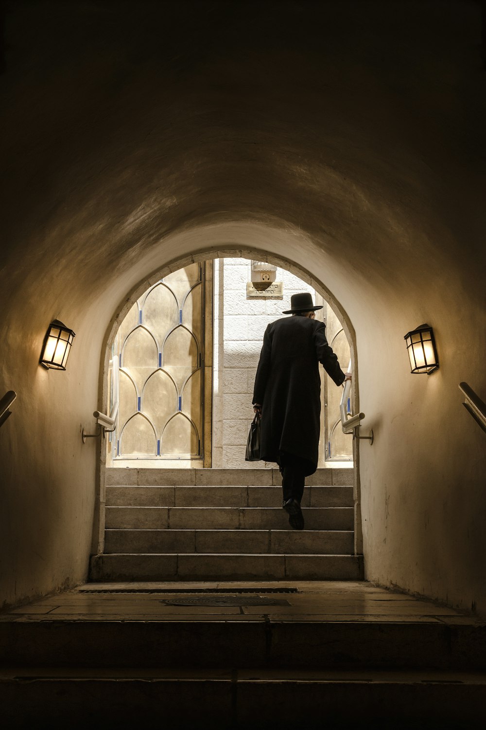 man walking near wall