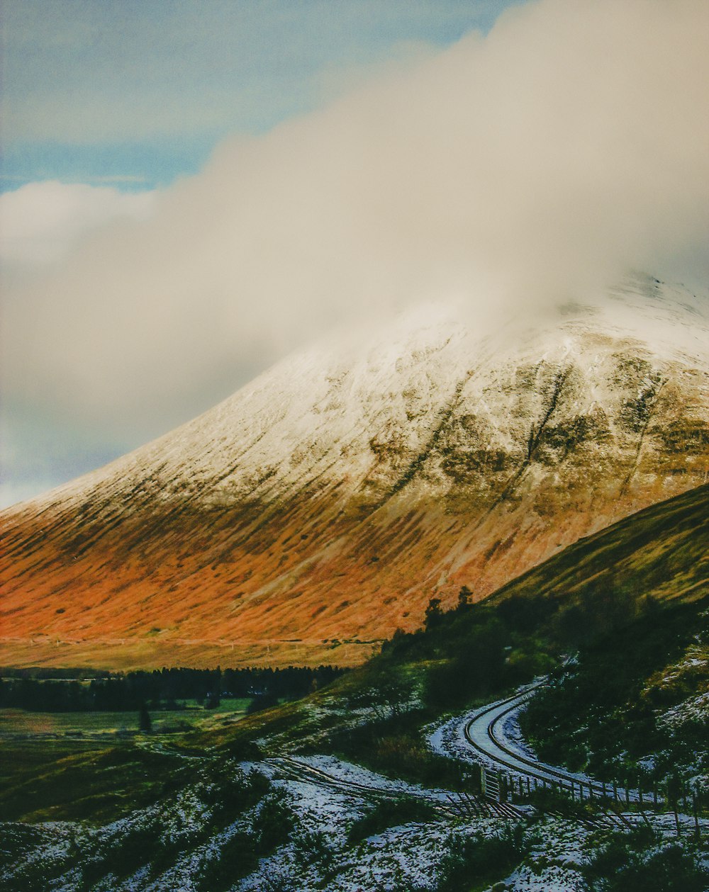 white and black mountain under blue sky