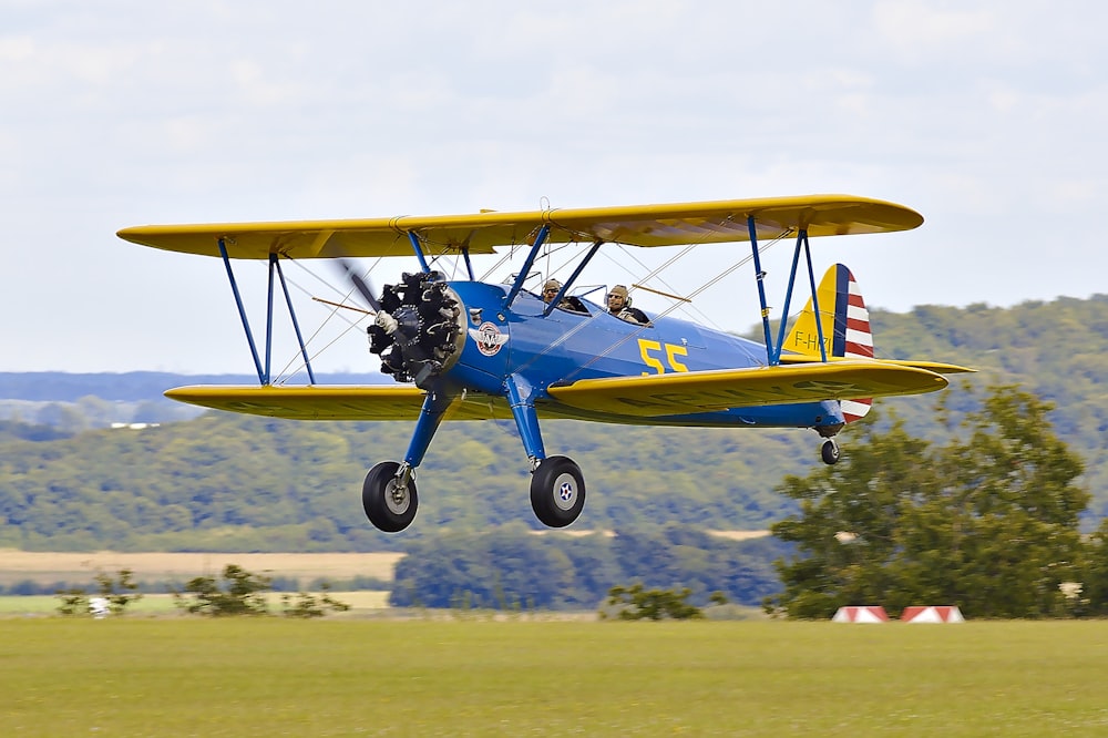 yellow and blue biplane