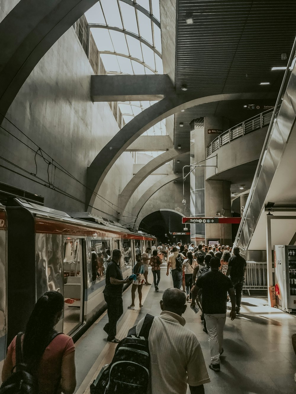 people walking beside train