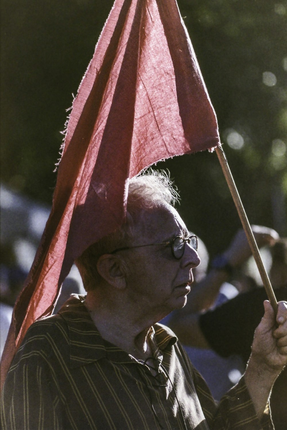 man holding red flag