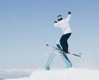 man doing tricks on skis