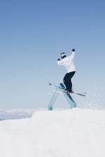 man doing tricks on skis
