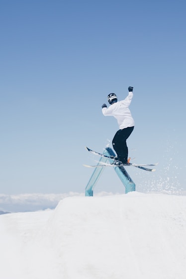 man doing tricks on skis