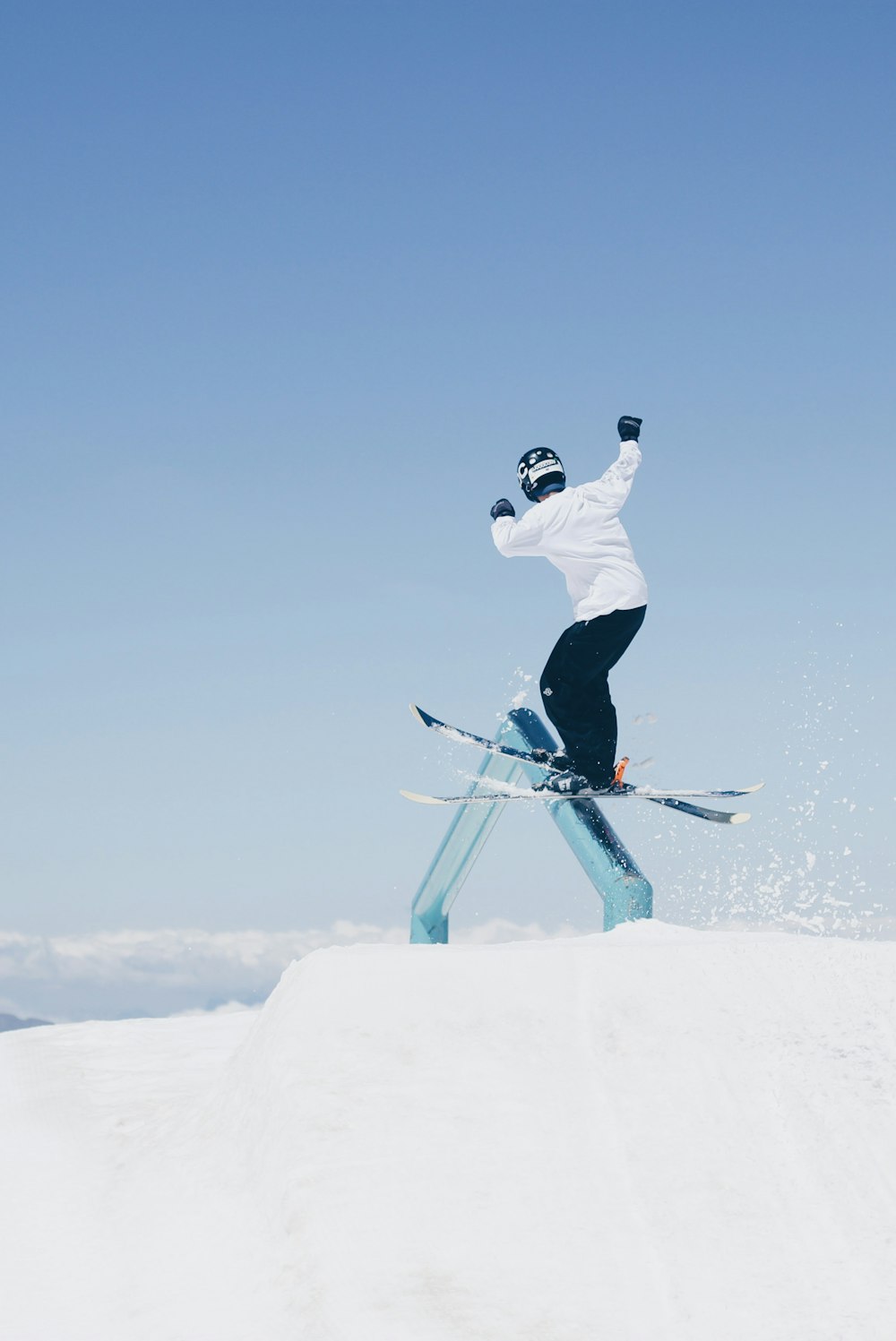 man doing tricks on skis