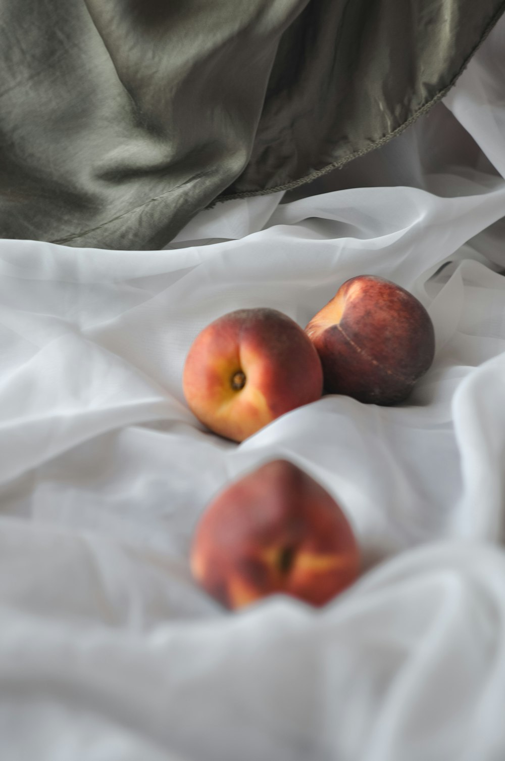 three red and yellow apple fruits