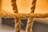 Close-up view of a thick rope made of intertwined fibers with a focus on its texture. The rope is stretched horizontally across the image with blurred background, emphasizing the details and fibrous nature.