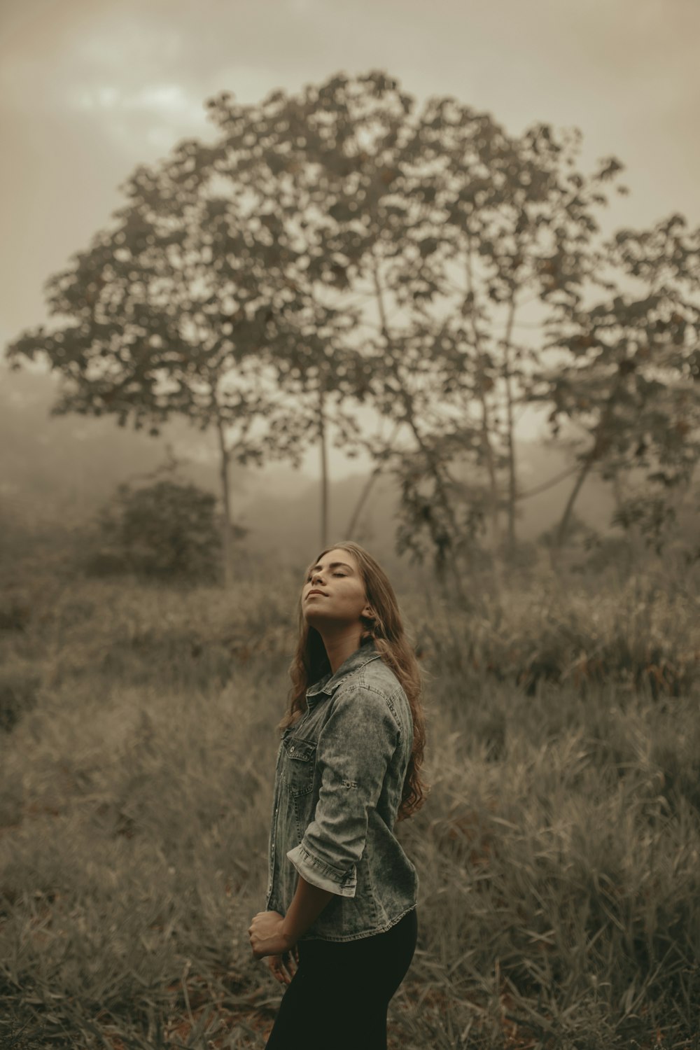 woman wearing blue denim jacket