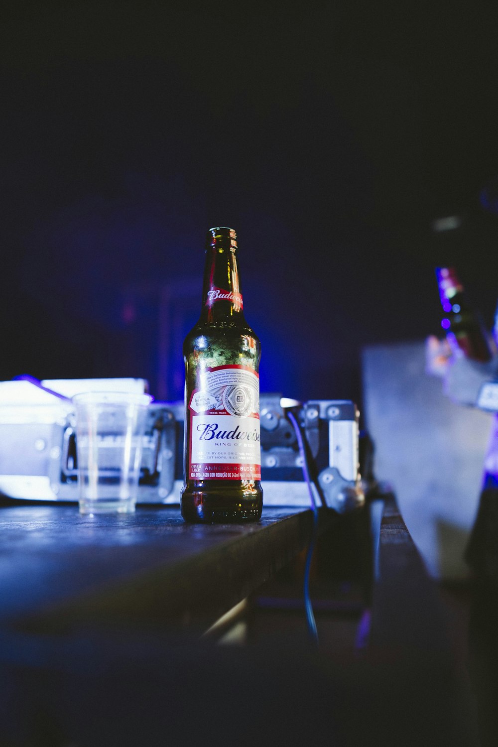 Budweiser bottle on brown wooden table