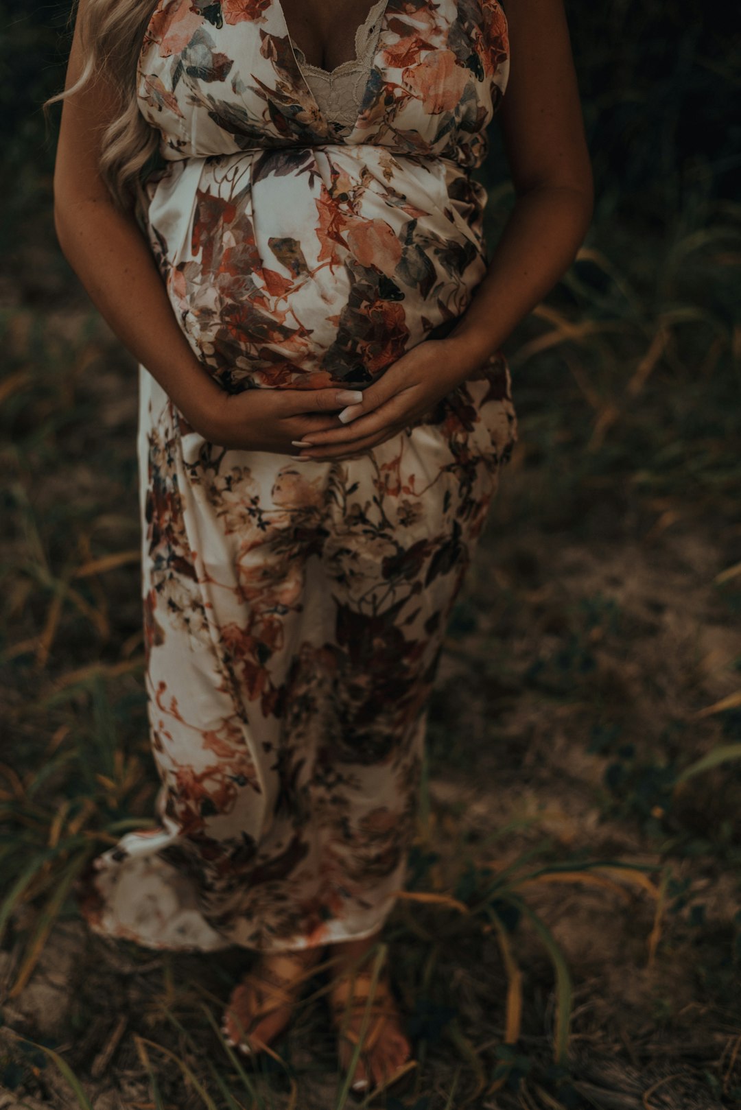 pregnant woman wearing floral maxi dress