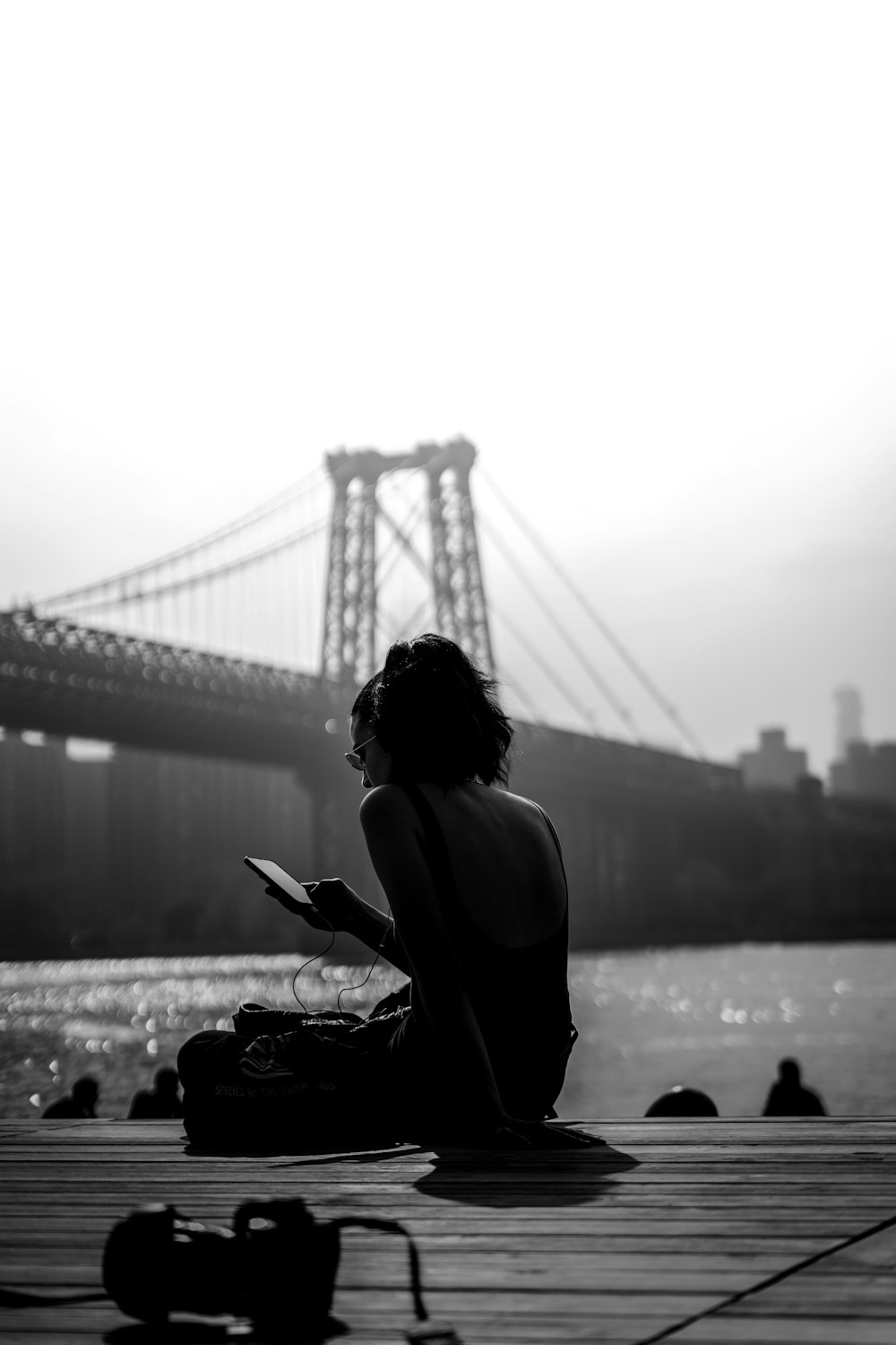 woman sitting on dock