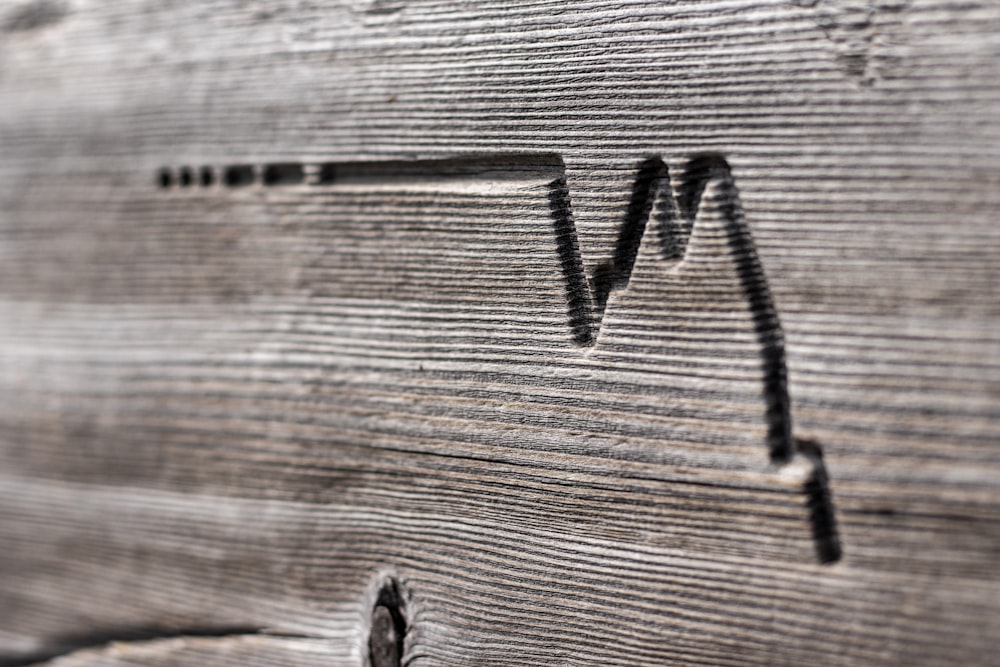 wave engraved on grey wood
