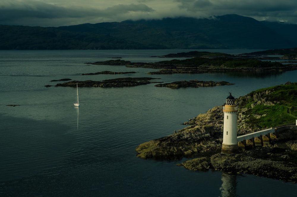 white lighthouse near body of water