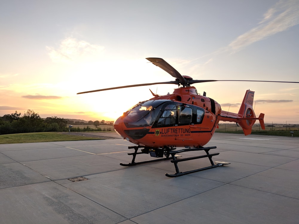 closeup photo of orange and black helicopter