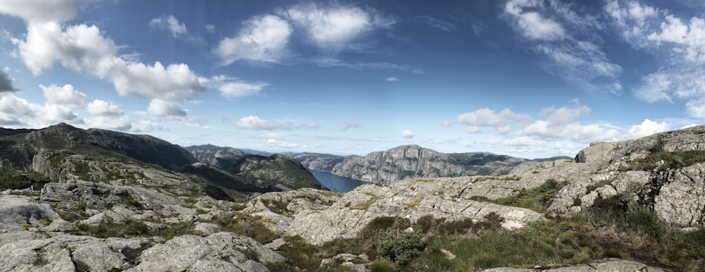 a view of a mountain range with a body of water in the distance