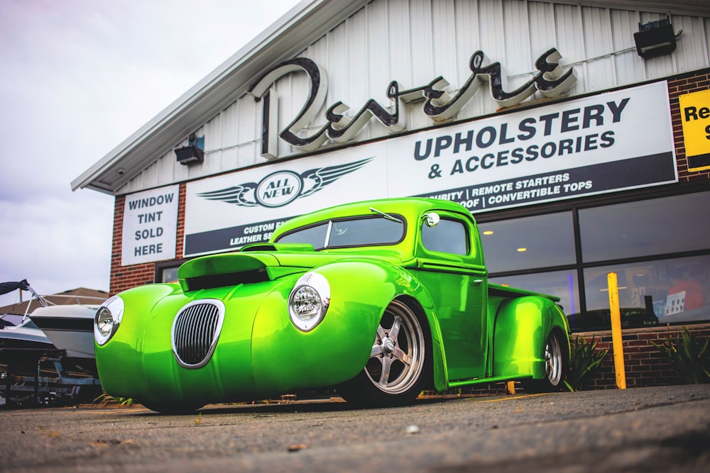 green vehicle park near store