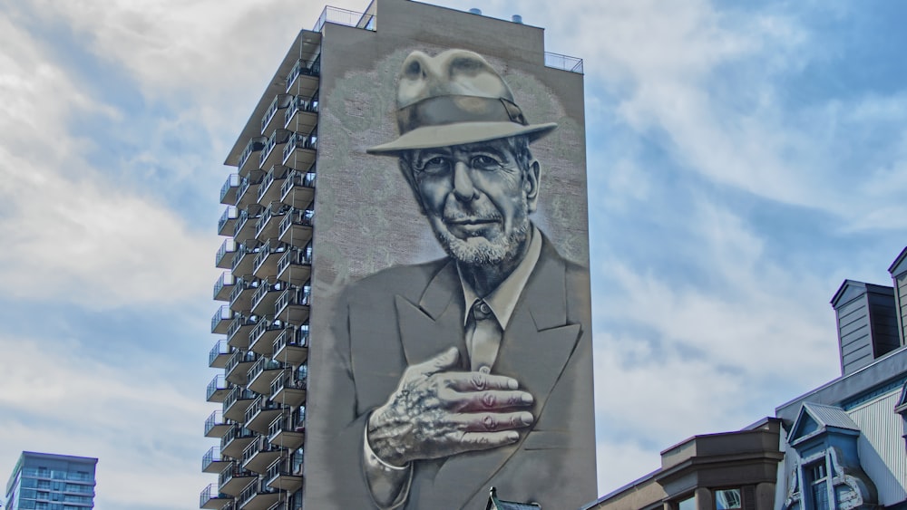 man in blazer on the side of the building