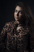 A model showcasing a flowing le mo’ney silk scarf in soft natural light.