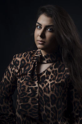 A model showcasing a flowing le mo’ney silk scarf in soft natural light.
