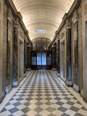 A vibrant marble tile arrangement in a spacious foyer.