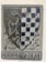 A stone relief featuring a heraldic shield. On the left, a detailed depiction of a bird with an elongated neck, likely an eagle or similar creature. The right side of the shield displays a checkered pattern of dark blue and white squares. Below the shield, the engraving reads 'DEGLI VBERTI'. The overall design is set against a rectangular stone background with subtle ornamental carvings.