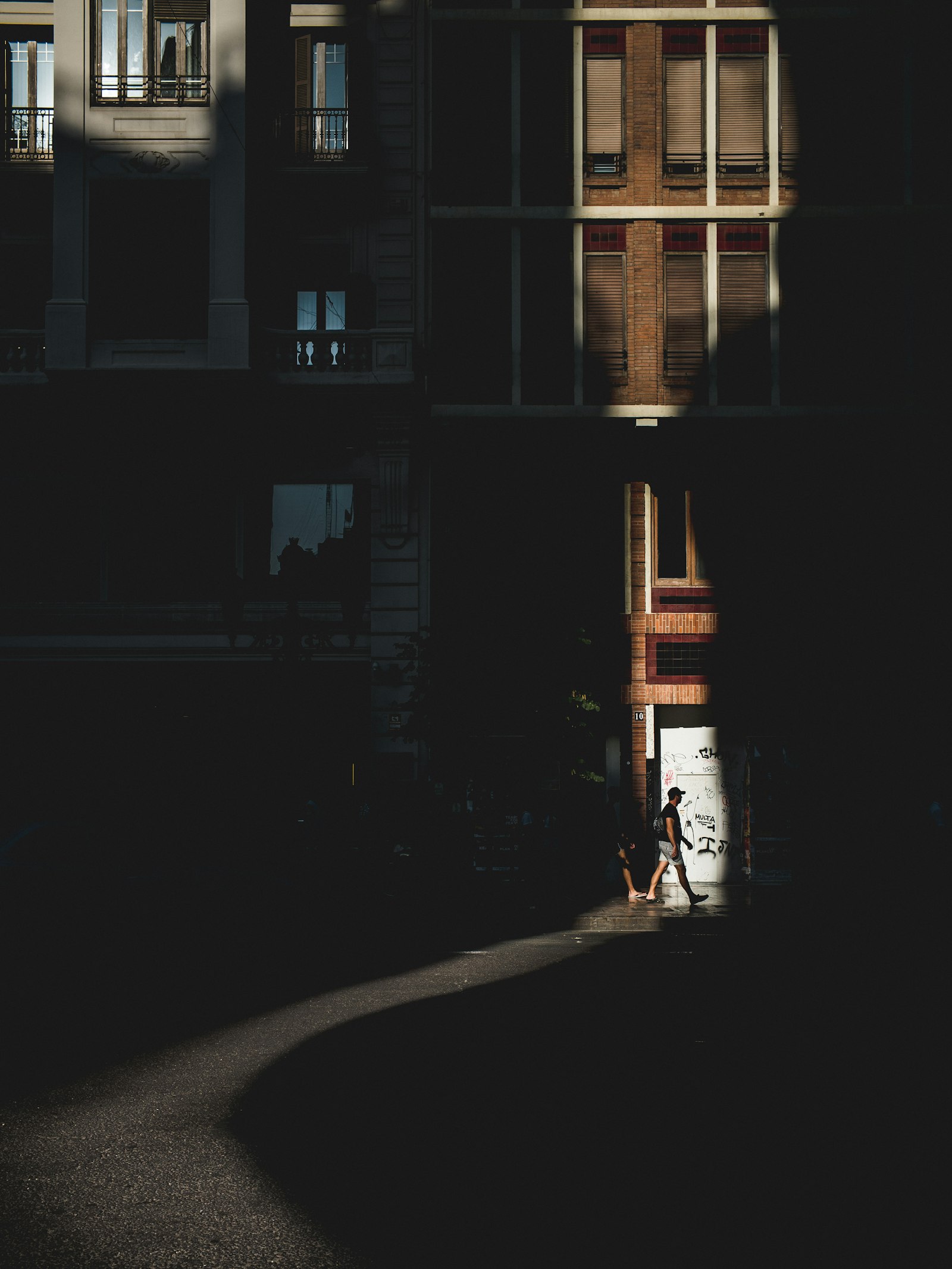 Leica M10-P sample photo. Man walking towards a photography