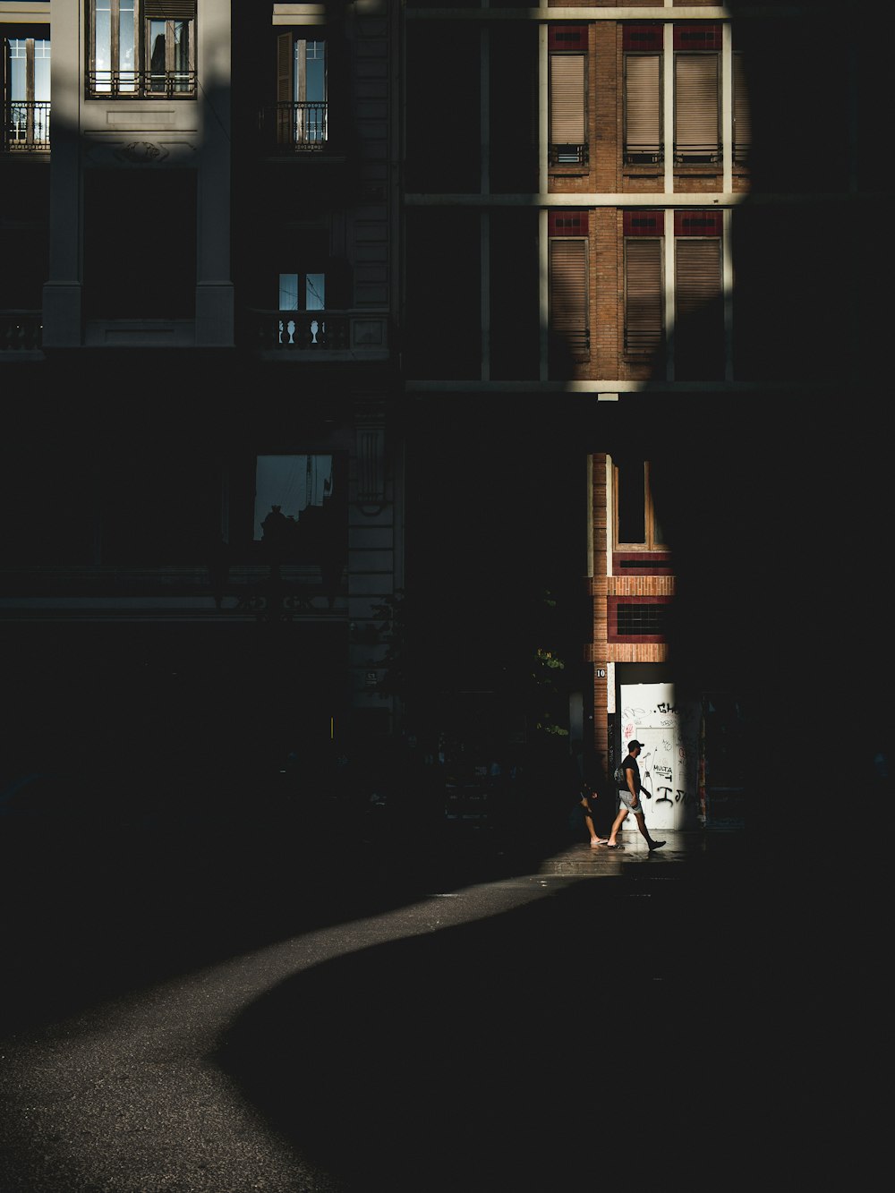 man walking towards a building