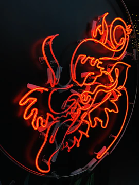 Close-up of a vibrant powder-coated metal sign with intricate plasma cut details.