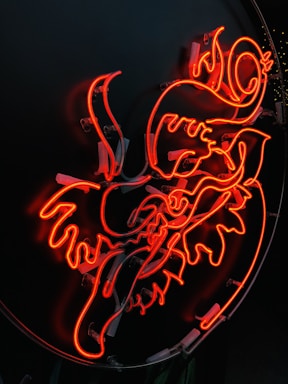 A vibrant plasma-cut metal sign with intricate Native American patterns glowing softly.