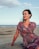 woman sitting on seashore