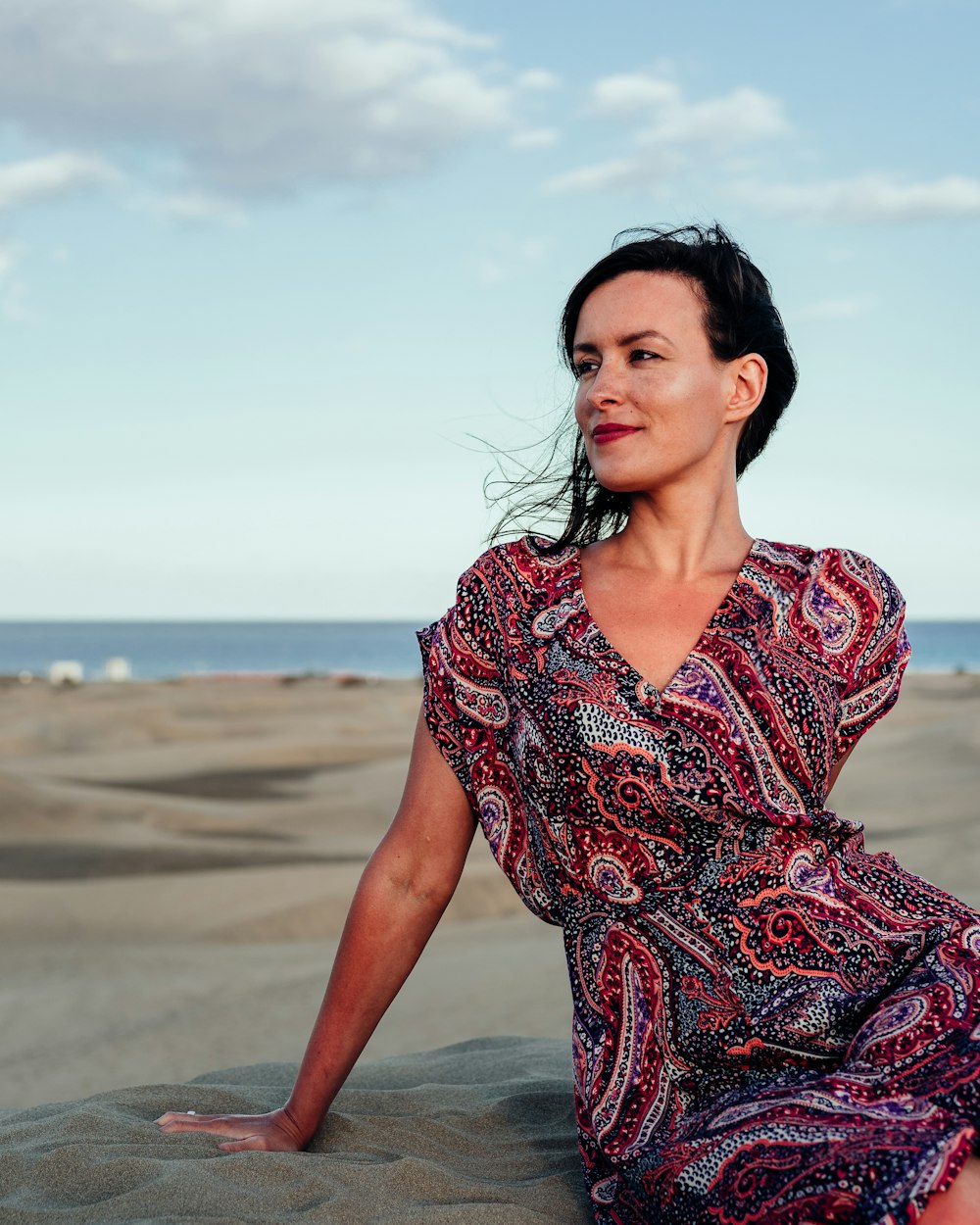 woman sitting on seashore