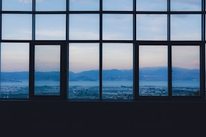 Window view showing mountain landscapes in the distance.