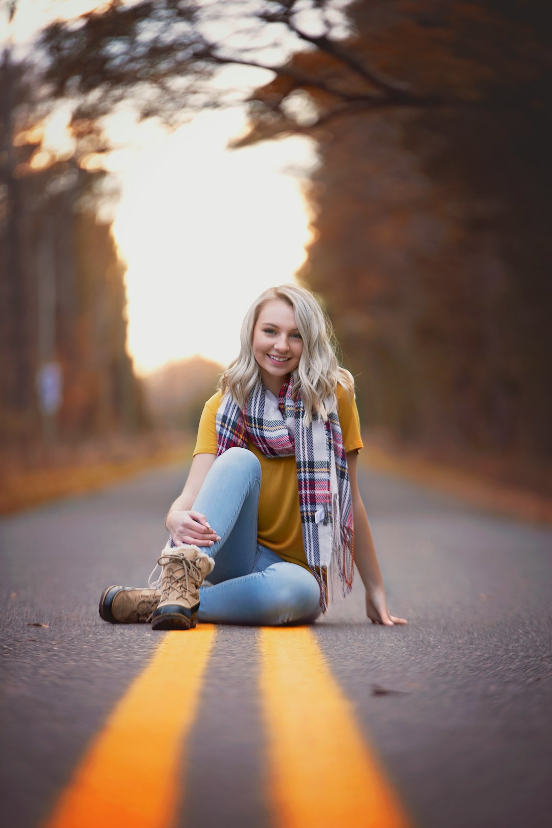 woman sitting on road