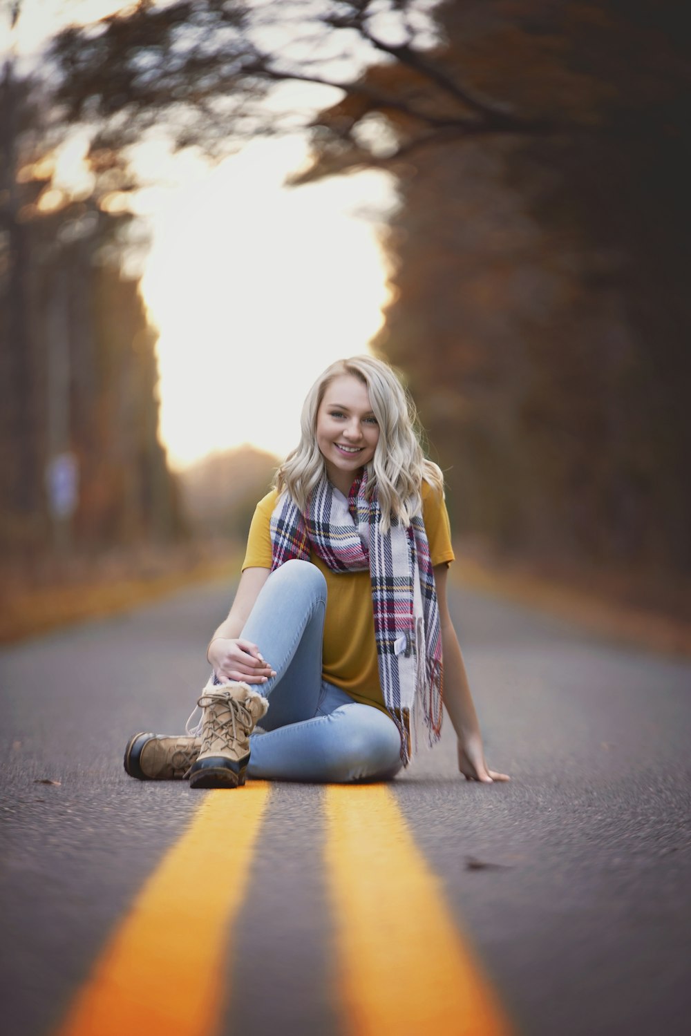 woman sitting on road