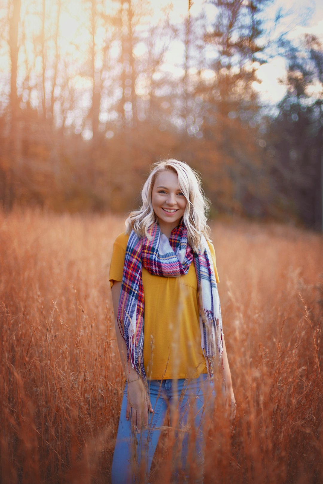 woman in scarf and orange top