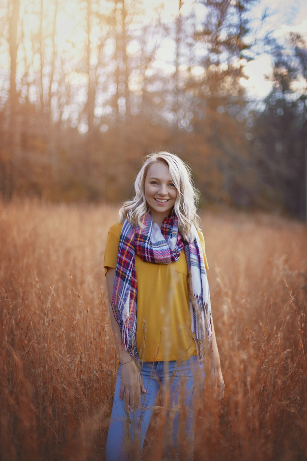 woman in scarf and orange top