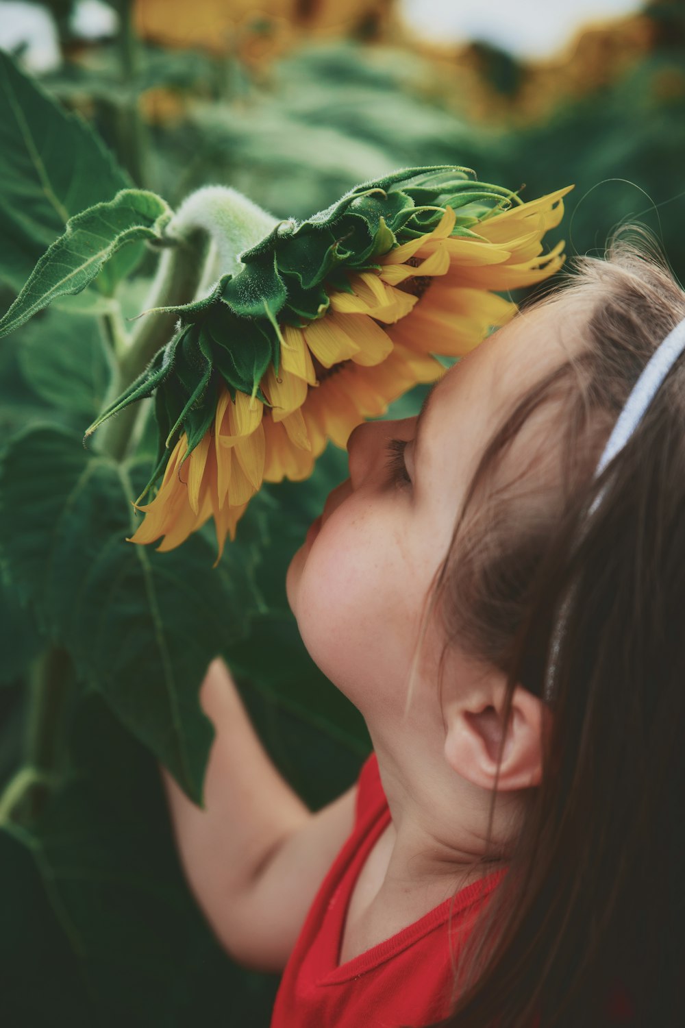 girl smelling flower