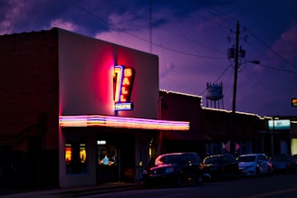vehicles parked in front of store