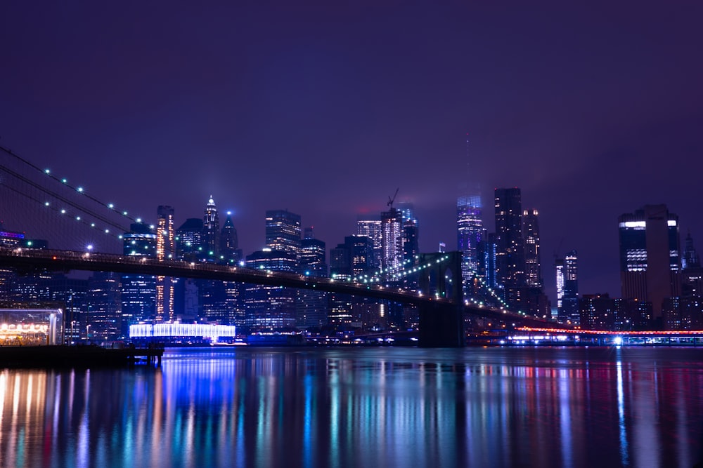 body of water across city buildings during nighttime