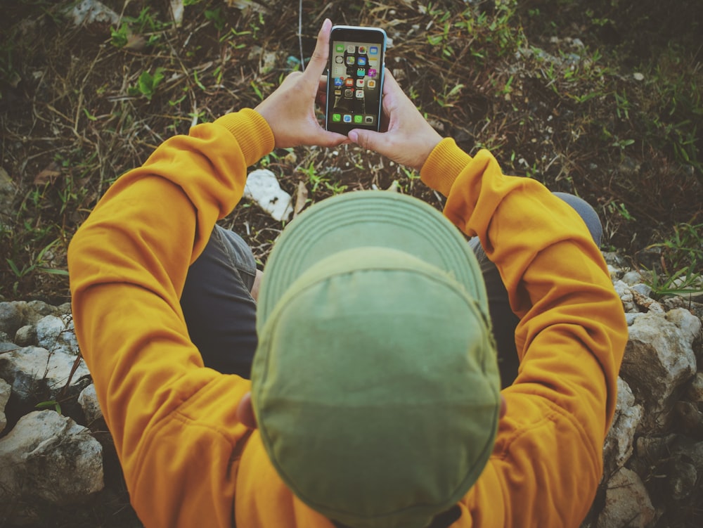 person sitting and using phone