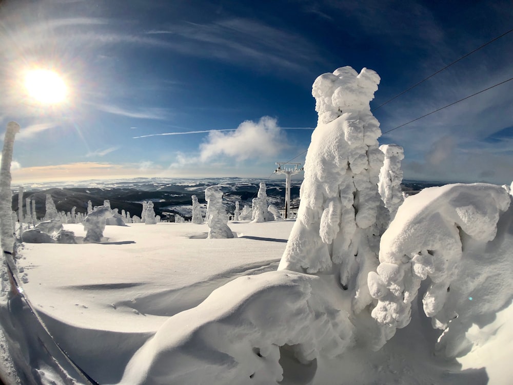 a snow covered mountain with a ski lift in the background