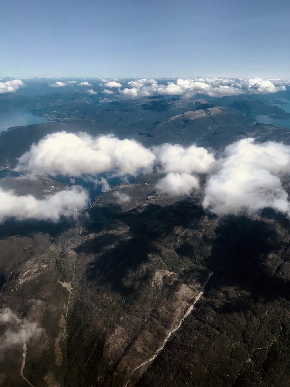 mountains under white clouds during daytime