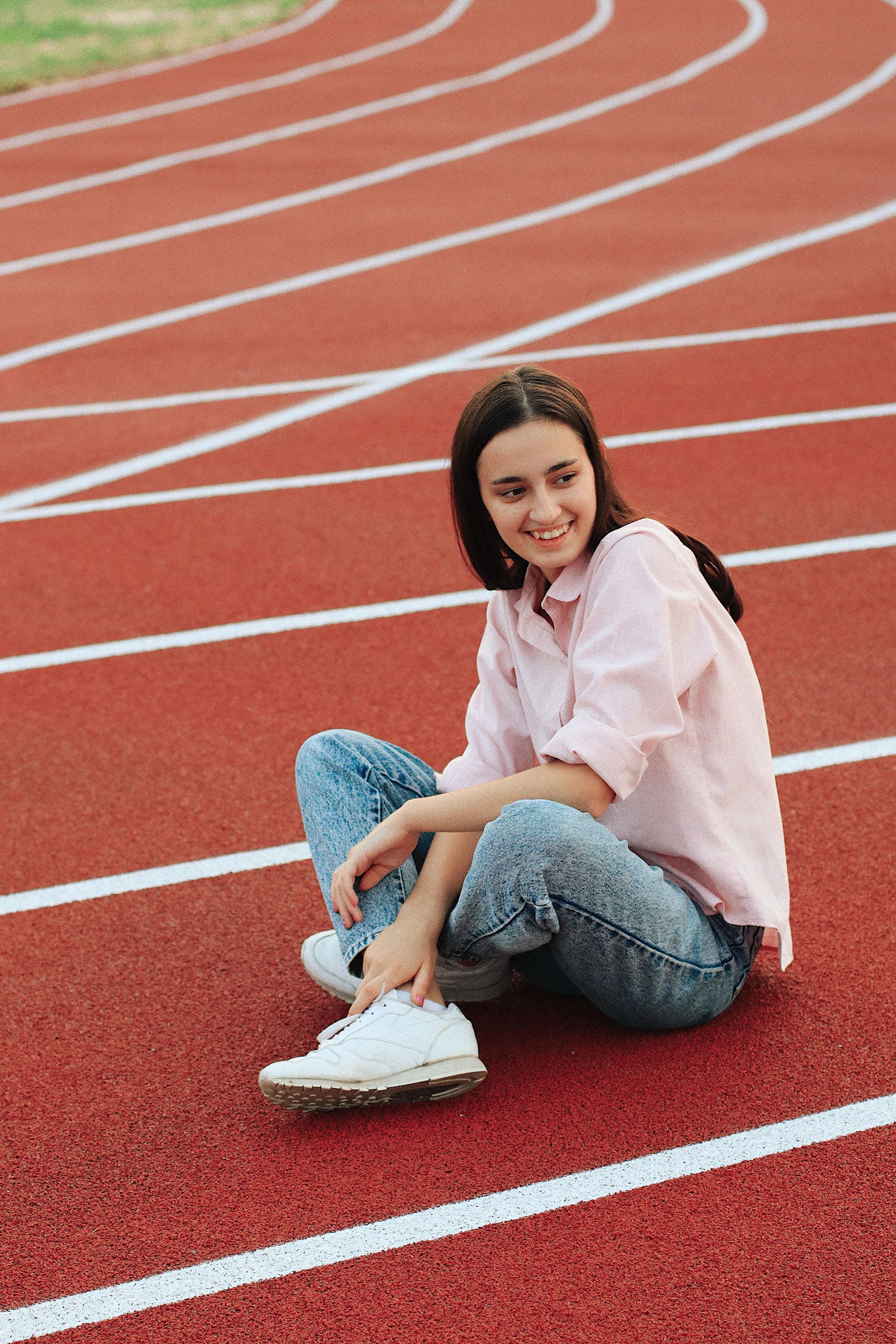 Athlete in sportswear preparing for outdoor movement