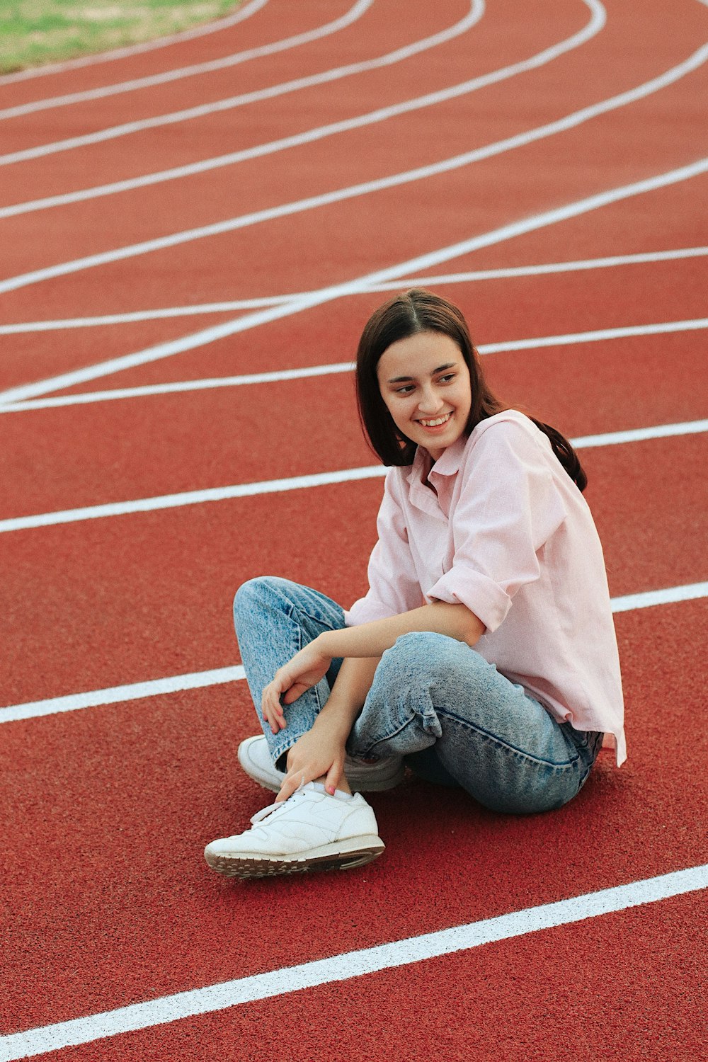 woman sitting on track