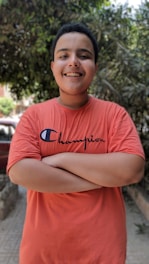 Happy winner holding cash prize with a big smile outdoors.