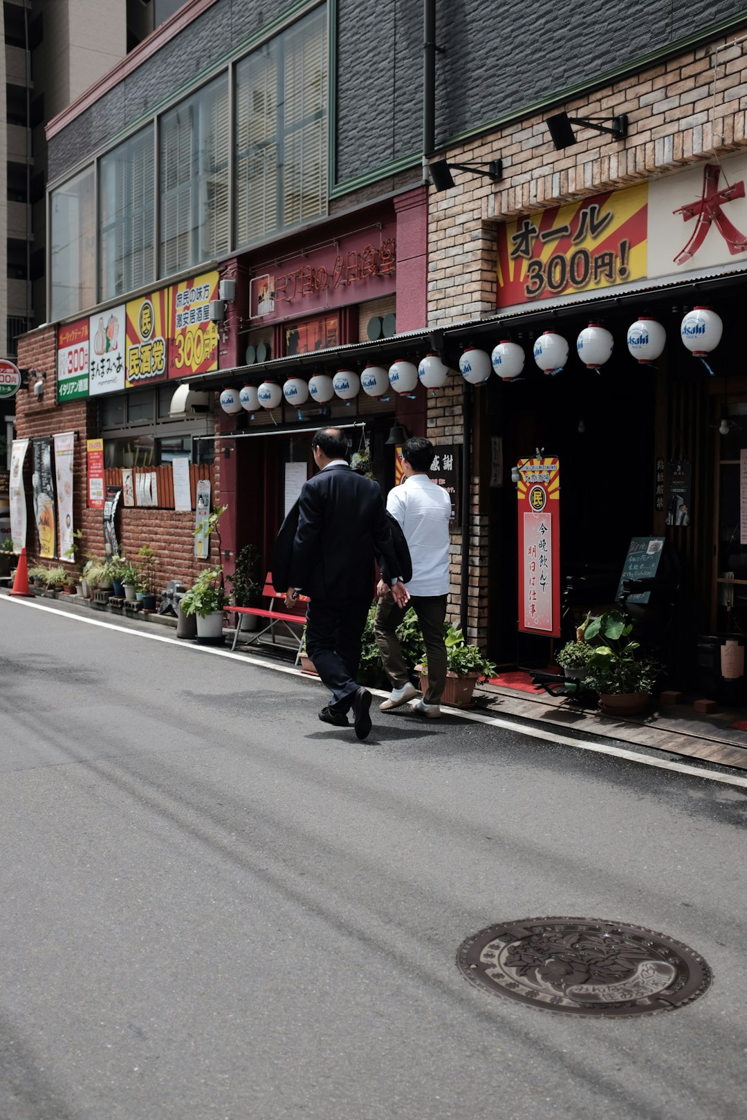 two men walking along street