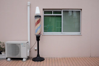 barber's lamp beside air condenser