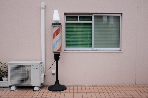barbershop sign - aircon vent - outdoors